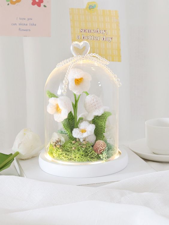 glass domes with crochet flowers